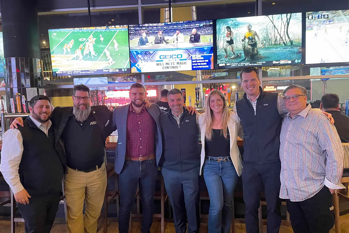 SecureWon team at a event standing together