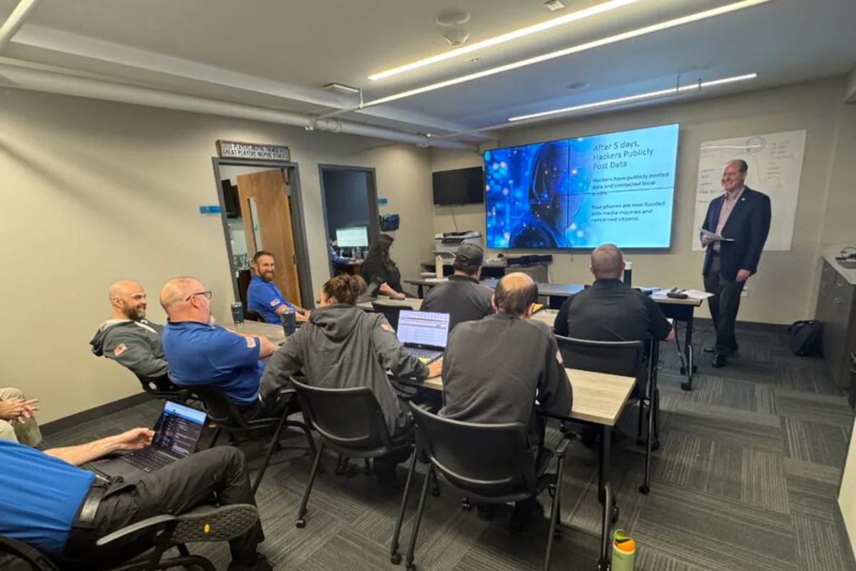 Team gathered around for presentation given at SecureWon offices