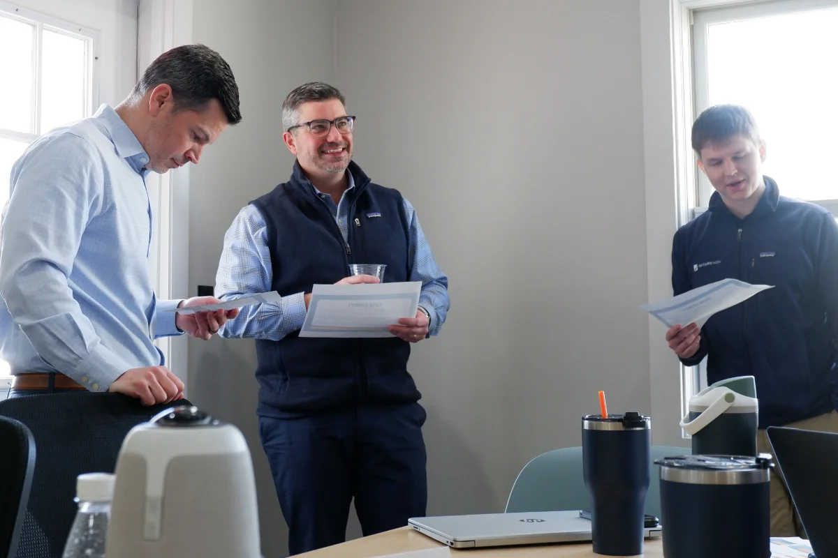 SecureWon team holding paper certificates from training day